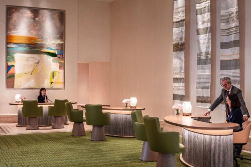 a rendering of a waiting room with people sitting at tables at Anantara Plaza Nice Hotel - A Leading Hotel of the World in Nice