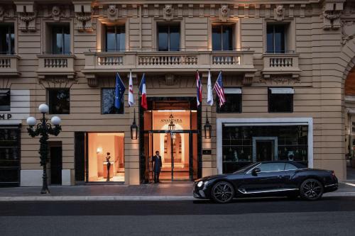 a black car parked in front of a building at Anantara Plaza Nice Hotel - A Leading Hotel of the World in Nice