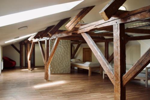 a room with two bunk beds and wooden beams at Skyview Hostel in Tallinn