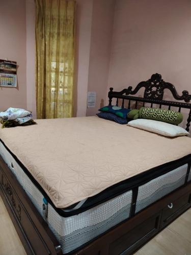 a bed in a room with a large mattress at Tokma homestay in Kuala Terengganu