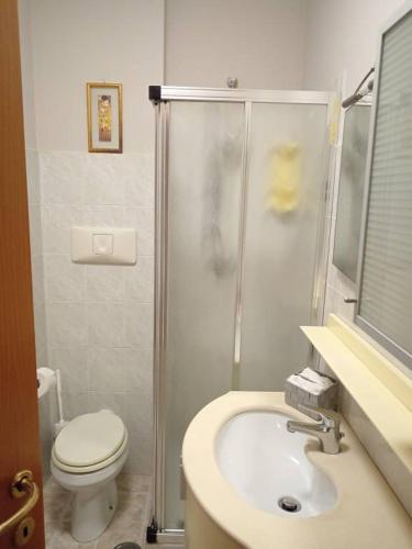 a bathroom with a shower and a toilet and a sink at Appartamenti Bellavista Club Tropea in Tropea