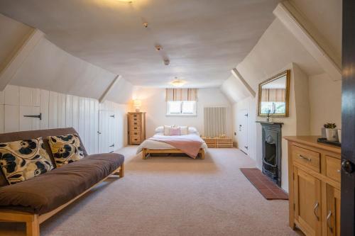 a bedroom with a bed and a fireplace at The Merchant House, Ipswich in Ipswich