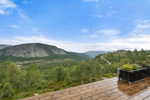 a house with a view of a mountain at Authentic Cabin Life With Løefjell View in Rysstad