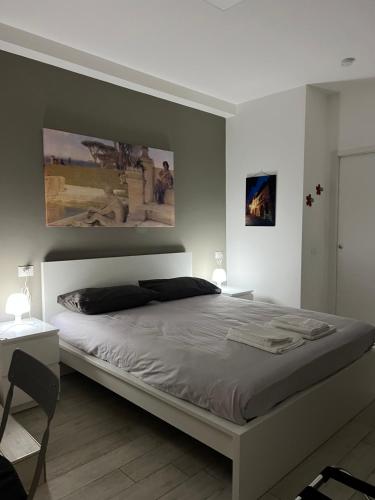 a bedroom with a large bed and two pictures on the wall at La Tulè in Popoli