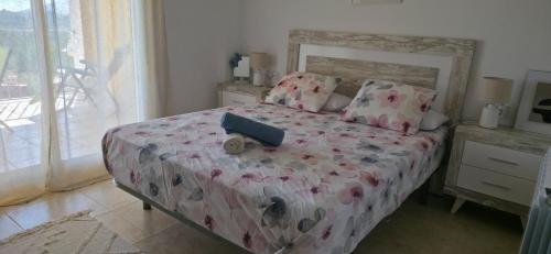 a bedroom with a bed with a doll on it at Sueno de Peniscola in Peniscola