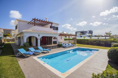 an image of a villa with a swimming pool at Villa Magali by Algarve Holidays in Galé