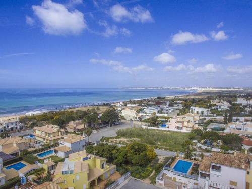 an aerial view of a city and the ocean at Villa Magali by Algarve Holidays in Galé