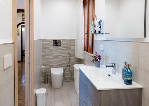 a bathroom with a sink and a toilet at Taormina Matthome in Taormina