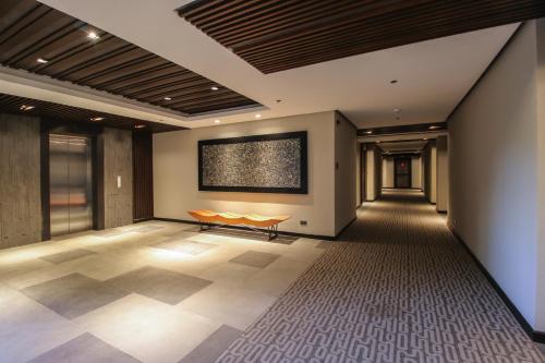 a large room with a large screen on the wall at Two Seasons Coron Bayside Hotel in Coron