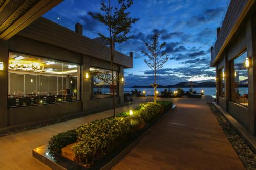 an exterior view of a building at night at Two Seasons Coron Bayside Hotel in Coron