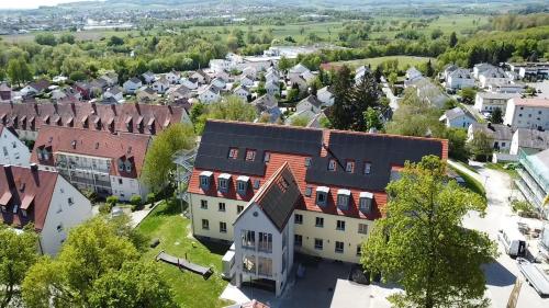 an aerial view of a small town with buildings at Cityhotel Donauwörth in Donauwörth