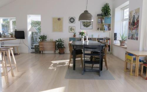 a dining room with a table and chairs in a room at ApartmentInCopenhagen Apartment 1323 in Copenhagen