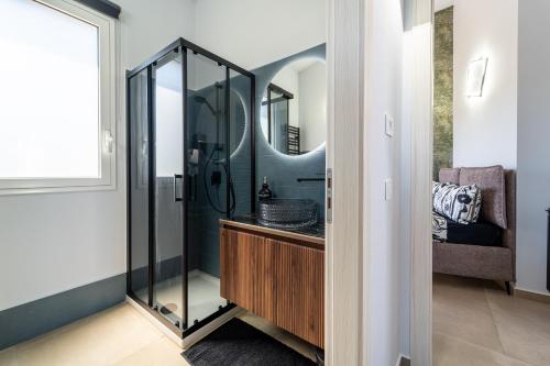 a bathroom with a sink and a mirror at Luxury SPA Villa Cefalù in Campofelice di Roccella