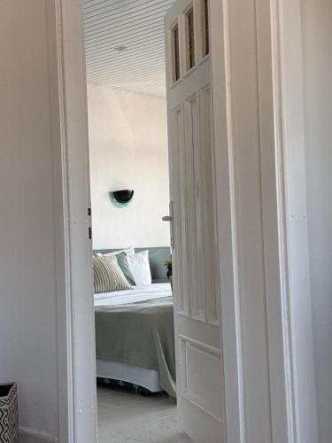 a door leading to a bedroom with a bed at Cleo Hotel in Alanya