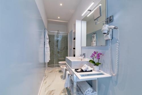 a bathroom with a sink and a shower at Miramare The Palace Resort in Sanremo