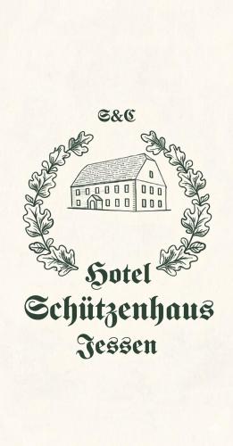 a drawing of a school with a laurelreath at Hotel Schützenhaus Jessen in Jessen