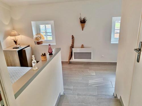 a hallway with a staircase in a house at Auberge du Bourguet in Brenon