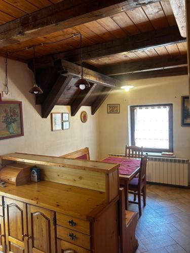 a dining room with a table and a table and chairs at Bovec Center Stay in Bovec