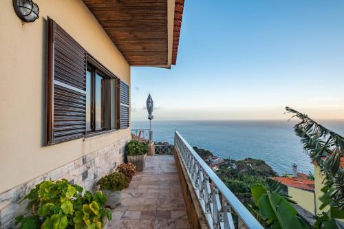 a balcony with a view of the ocean at White Rabbit I by Homie in Calheta