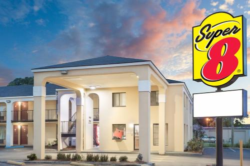 a rendering of a super sign in front of a building at Super 8 by Wyndham Eufaula in Eufaula