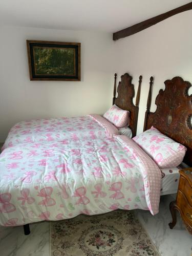a bedroom with a bed and two chairs at Malva in Grado