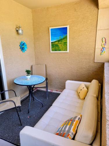 a living room with a couch and a table at 2 Bedroom 2 Bathroom Ground Floor Condo Ahwatukee in Phoenix