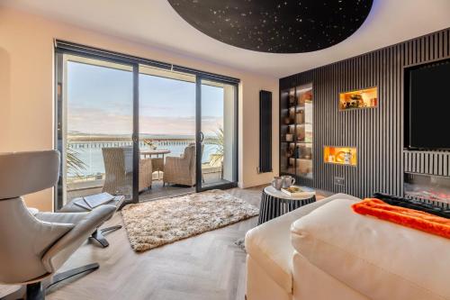 a bedroom with a bed and a view of the ocean at 3 Bed in Amble oc-h36627 in Amble