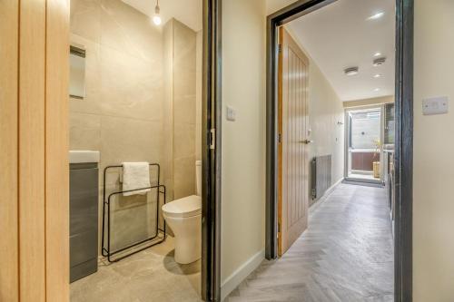 a bathroom with a toilet and a walk in shower at 3 Bed in Amble oc-h36627 in Amble