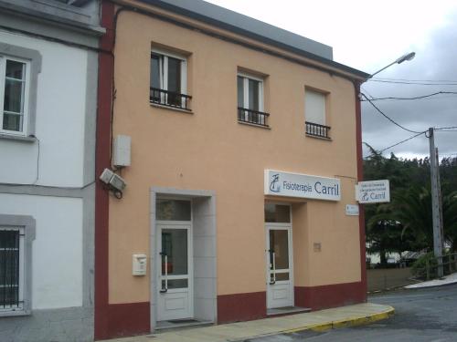 a building with a sign on the side of it at Apartamento Ana Sebastián in Lorenzana