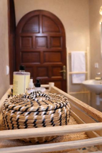 a wicker cake sitting on a table in front of a door at Villa Dar Nata in Tougouana
