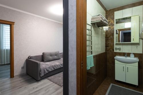 a bathroom with a sink and a toilet and a shower at Apartaments Miro in Chişinău