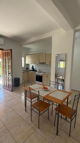 a kitchen with a table and chairs in a room at Apartment for Relaxed Holidays 3 in Kriezá