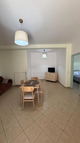 a living room with a table and chairs and a couch at Apartment for Relaxed Holidays 4 in Kriezá