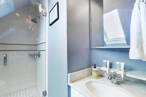 a bathroom with a sink and a shower at Morning on the Atlantic in Portland