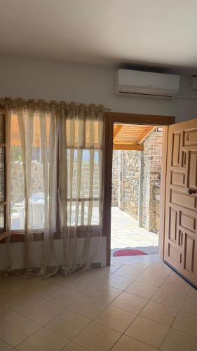 an open door with curtains in a room at Apartment for Relaxed Holidays 4 in Kriezá
