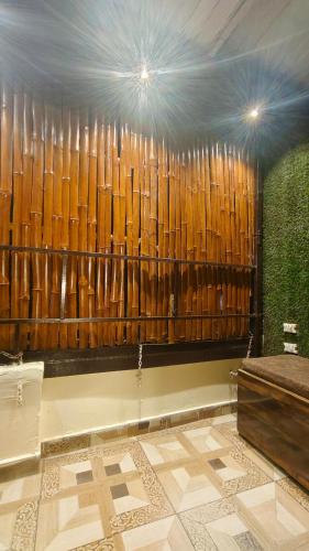 a room with a wall of wooden panels at Hotel virat inn in Gwalior