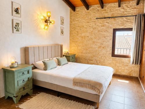 a bedroom with a large bed and a window at La Rustiqueta Javea terraza BBQ casco antiguo in Jávea