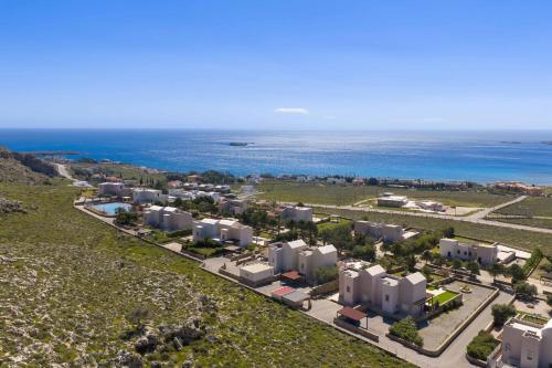 an aerial view of a resort near the ocean at Aethrion Villa Lindos in Lindos