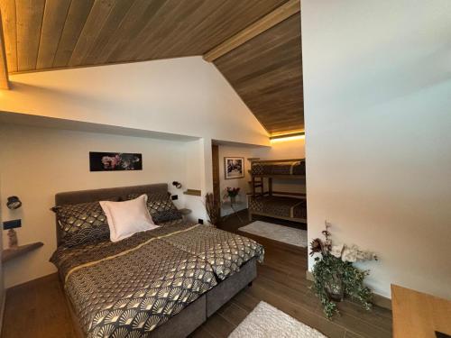 a bedroom with a bed in a room at Ferienhaus Kramser in Arnoldstein