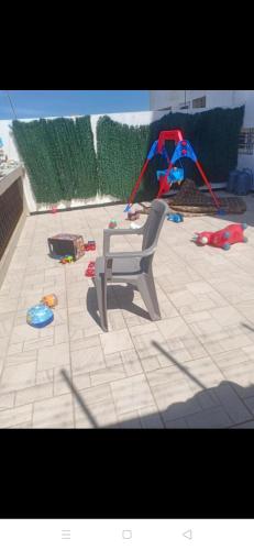 a playground with a bench and toys on the ground at Rabat Luxury in Salé