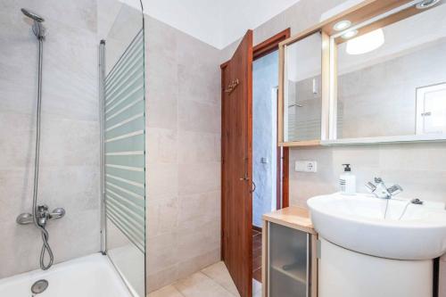 a bathroom with a sink and a shower at Villa Binisol in Binibeca