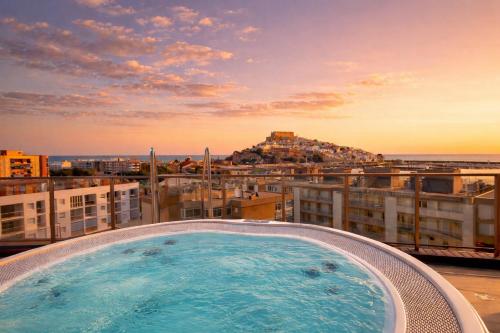 a hot tub on the roof of a building at Palladium Hotel Peñiscola in Peniscola