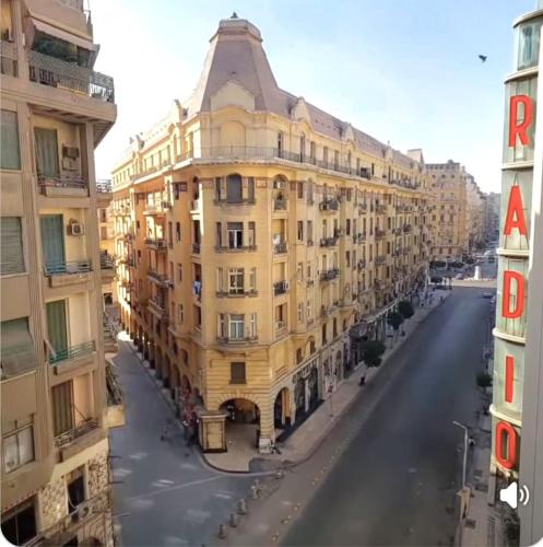 a large yellow building on the side of a street at An ancient pal ace in Cairo