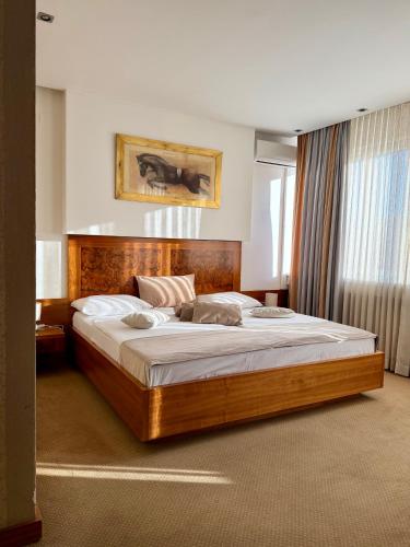 a bedroom with a large bed in a room at Hotel Exclusive in Sarajevo