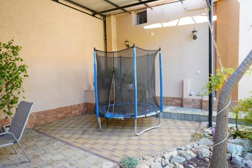 a screened in porch with a shower in a house at Apartments Valentinaa in Gevgelija