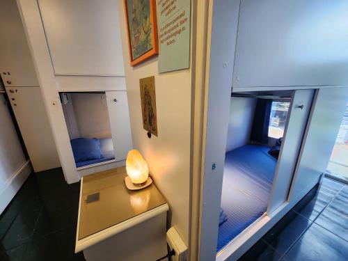 a room with a desk with a lamp on it at Mandala Yoga Hostel in Bogotá