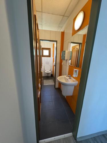 a bathroom with a sink and a toilet at Barbora kemp Kutná Hora in Kutná Hora