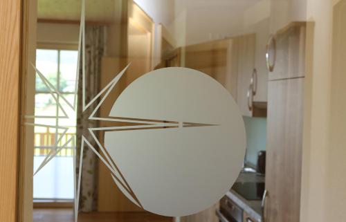 a large white orb in a kitchen with a kitchen at Alpenperle in Ramsau am Dachstein