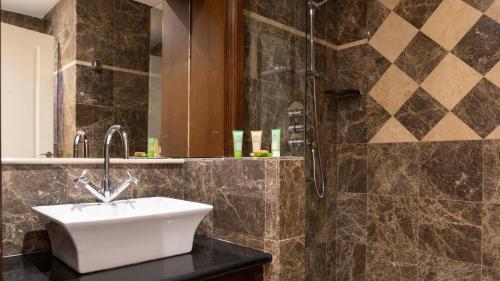 a bathroom with a sink and a shower at Schull Harbour Hotel & Leisure Centre in Schull