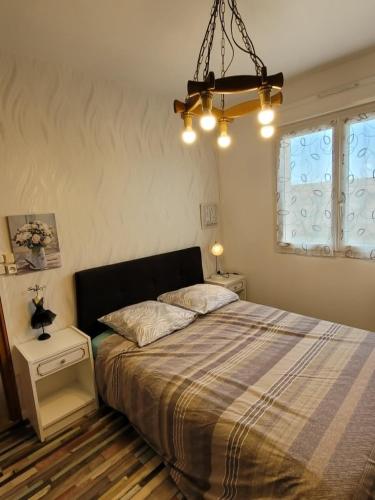 a bedroom with a bed and two night stands at Charmes à Changey in Changey